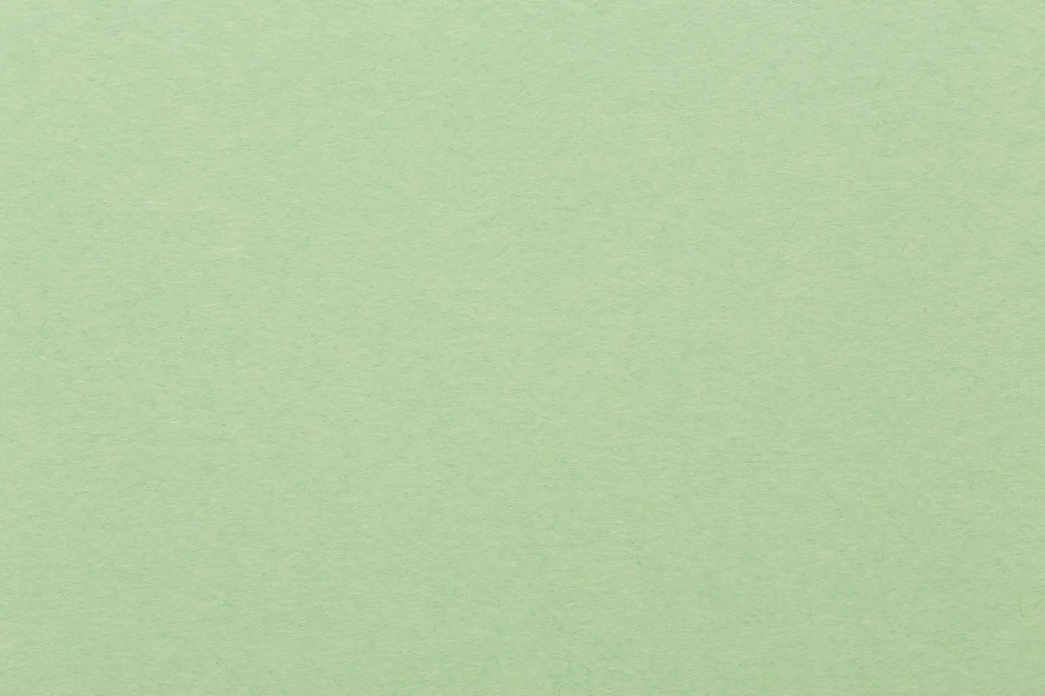 Hellgrüner Papierhintergrund, bunte Textur.